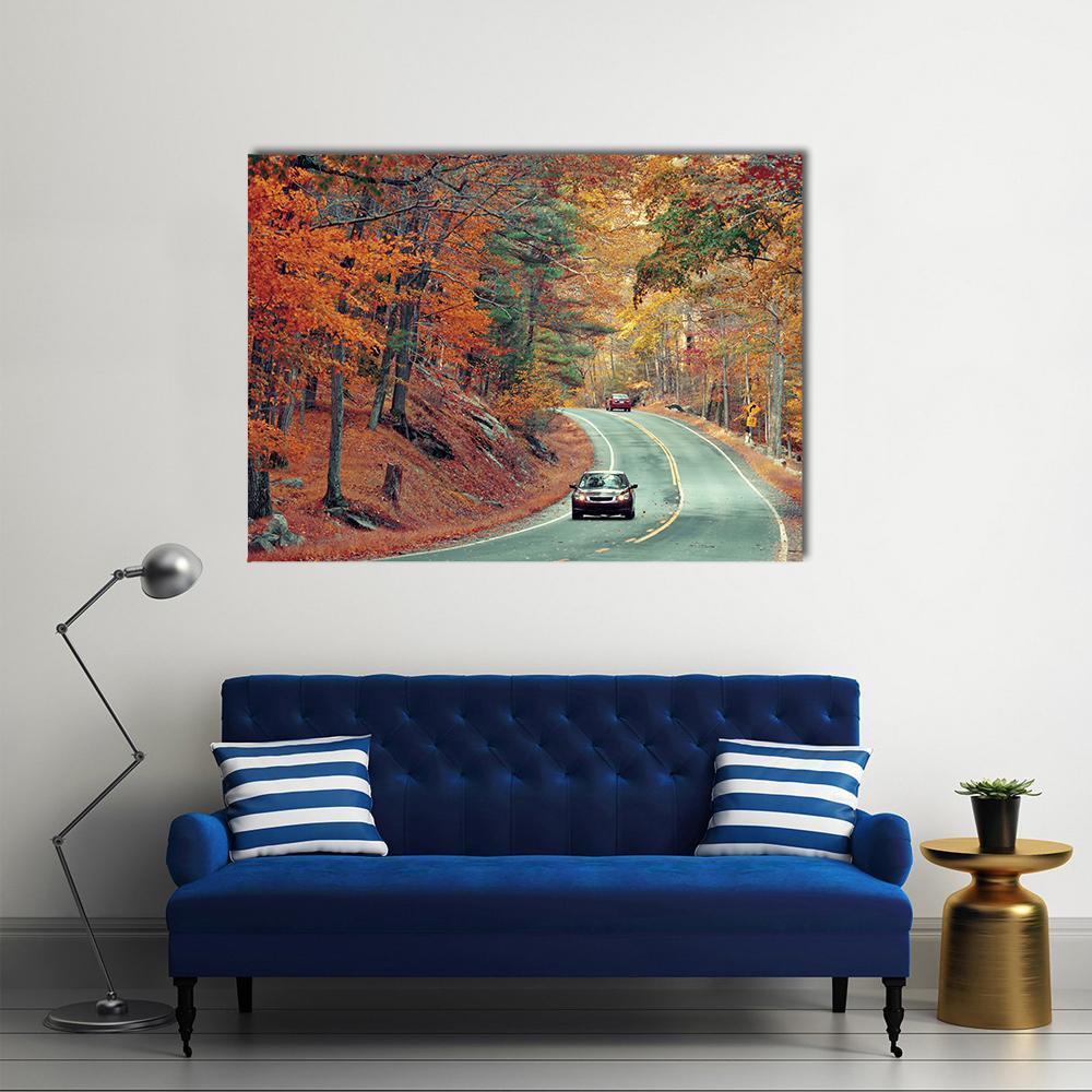 Cars on Autumn Road Canvas Wall Art in brown, orange and green, single panel hung on a wall