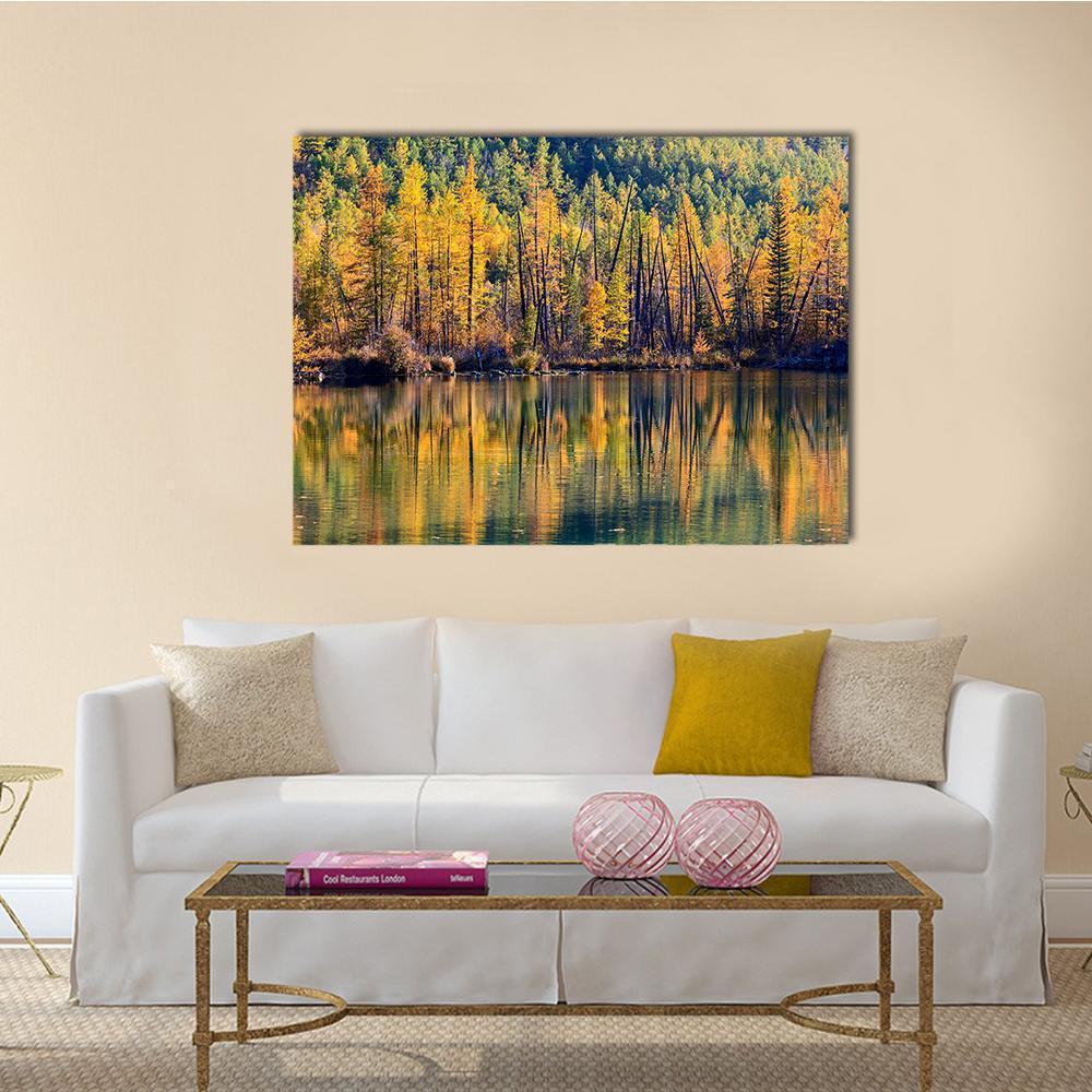 Autumn Forest Reflected in Lake Canvas Wall Art in orange, yellow and green, single panel hung on a wall