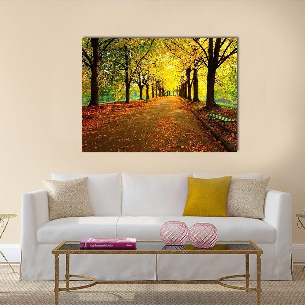 Autumn in City Park Canvas Wall Art in brown, orange and yellow, single panel hung on a wall