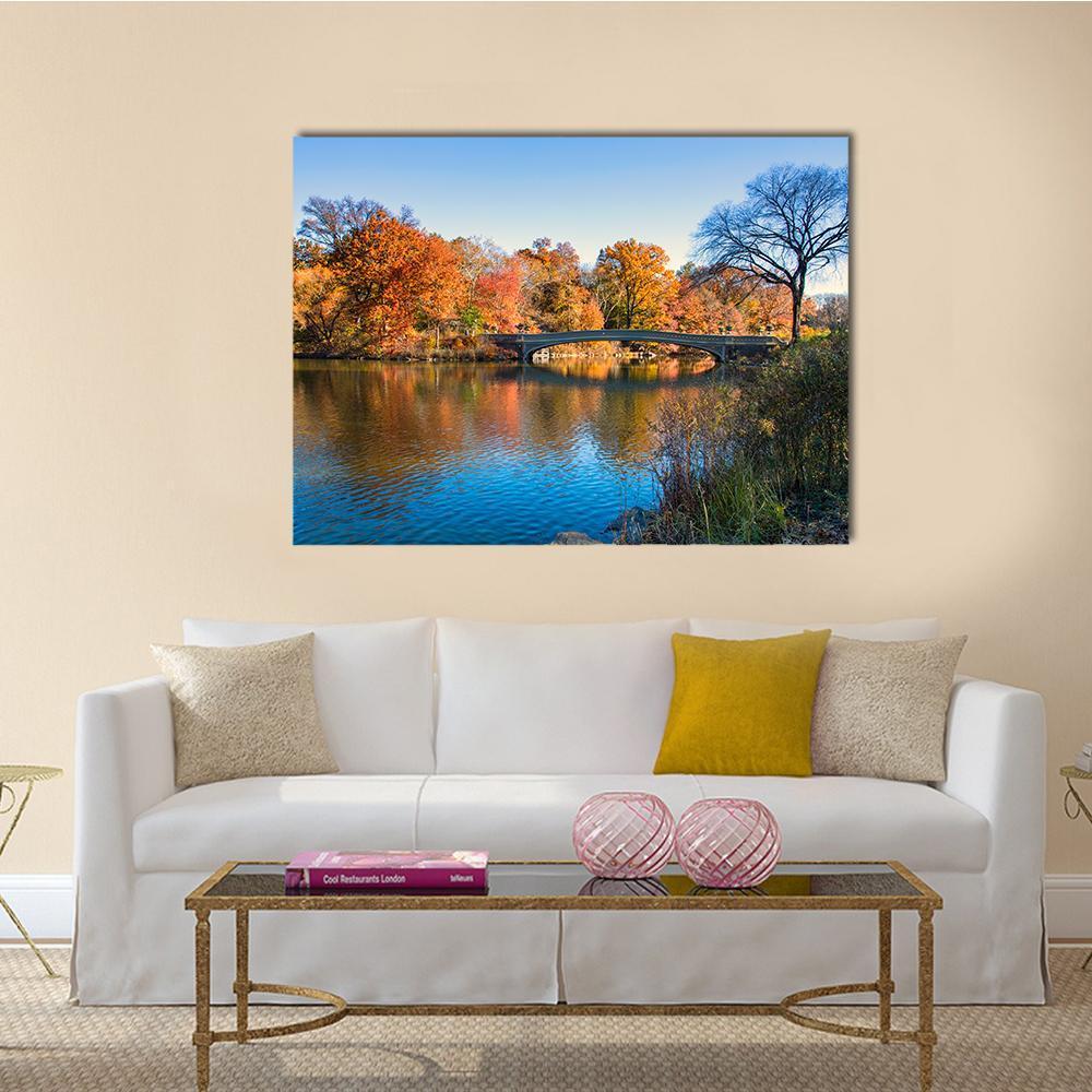 Autumn at Bow Bridge, Central Park Canvas Wall Art in brown, orange and blue, single panel hung on a wall