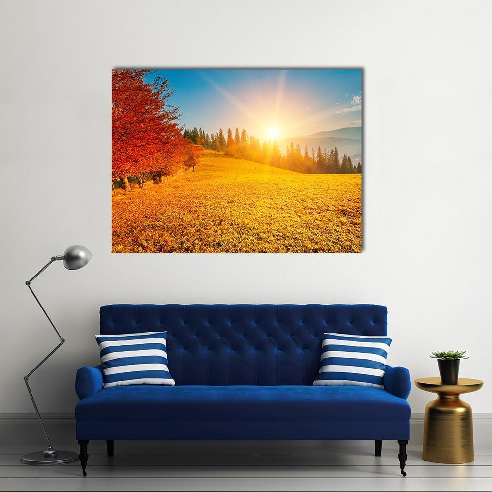 Autumn Mountain Field at Sunset Canvas Wall Art in orange, yellow and blue, single panel hung on a wall