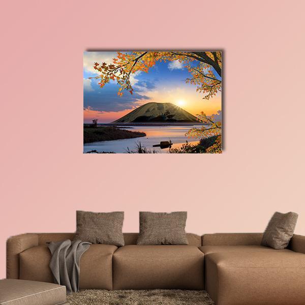 Autumn Mountain Lake at Sunset Canvas Wall Art in orange, yellow and blue, single panel hung on a wall