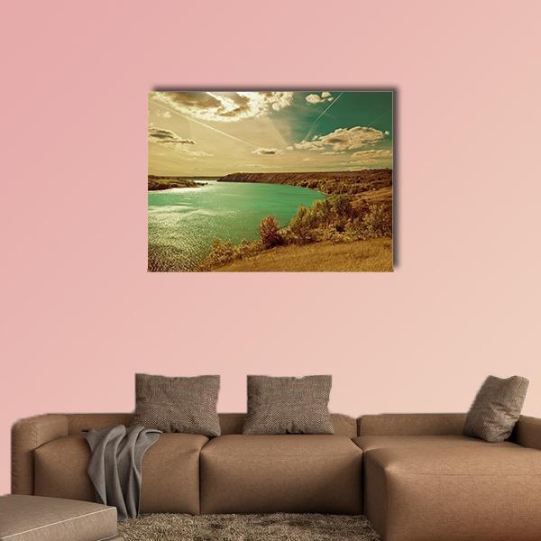 Autumn Riverside Landscape Canvas Wall Art in brown, yellow and blue, single panel hung on a wall