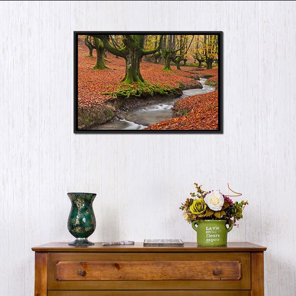 Autumn Forest Stream with Mossy Trees Canvas Wall Art in brown, orange and green, framed canvas, product view on a white background
