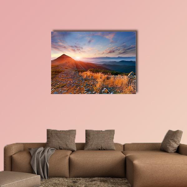 Autumn Sunrise Over Mountains Canvas Wall Art in brown, orange and blue, single panel hung on a wall