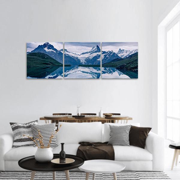 Lake Bachalpsee Switzerland Alpine Reflection Panoramic Canvas Wall Art in white, gray and blue, hung on a wall