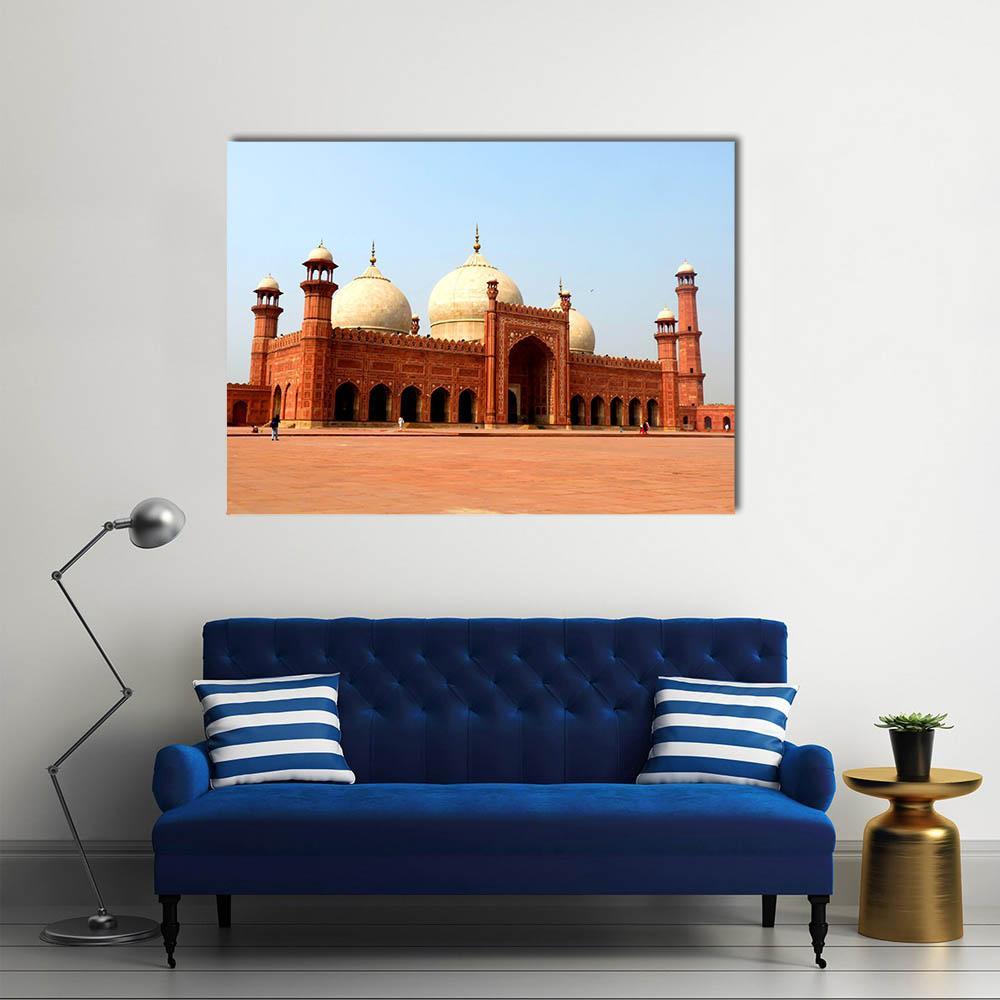 Badshahi Mosque in Daylight Canvas Wall Art in red, orange and blue, single panel hung on a wall