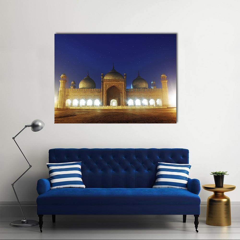 Badshahi Mosque at Night Canvas Wall Art in brown, gold and blue, single panel hung on a wall