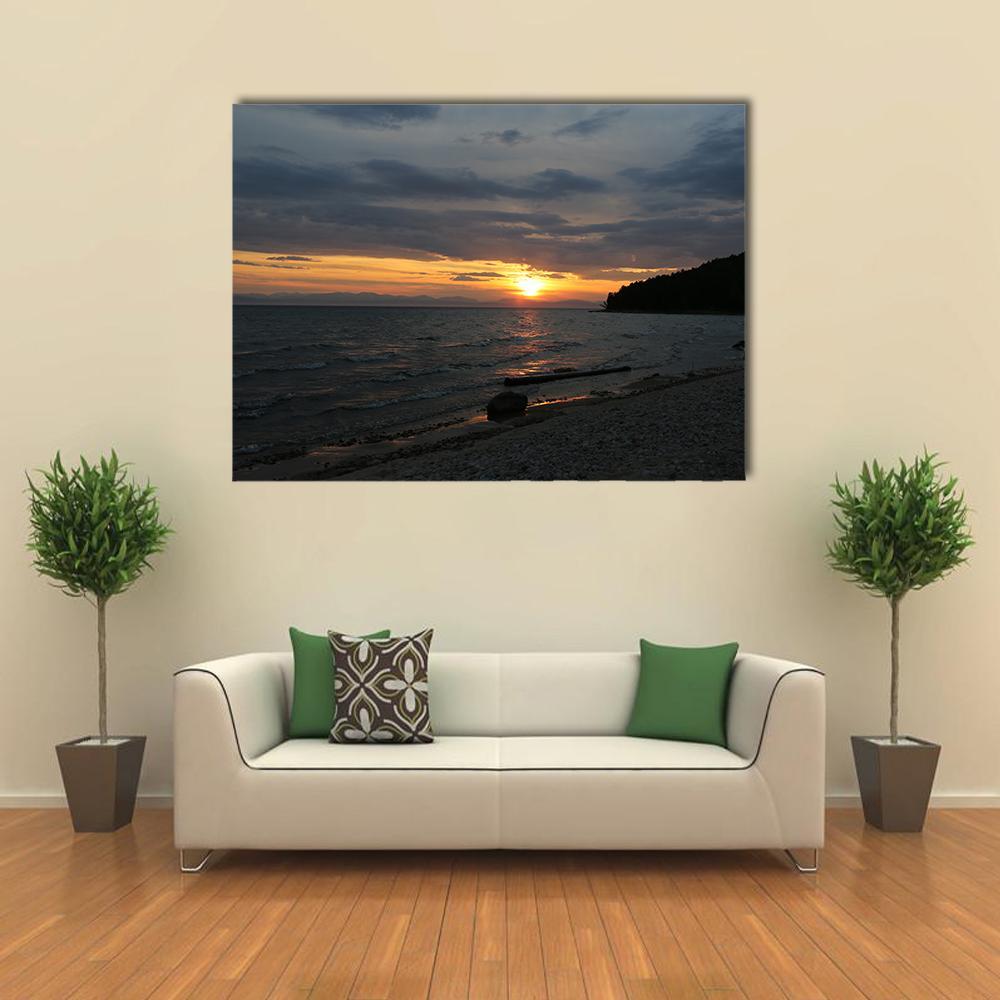 Baikal Lake at Sunset Canvas Wall Art in black, orange and blue, single panel hung on a wall