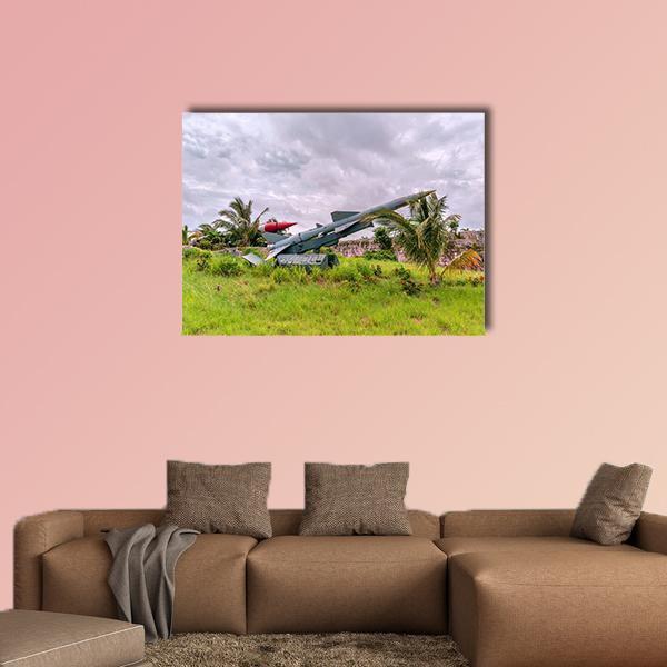 Ballistic Missile and Crashed Airplane Canvas Wall Art in white, gray and green, single panel hung on a wall