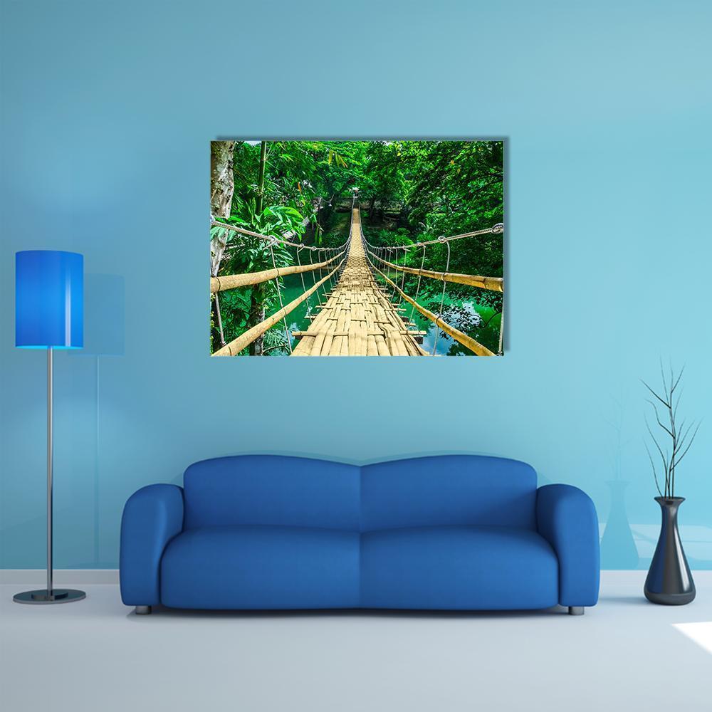 Bamboo Suspension Bridge Canvas Wall Art in brown and green, single panel hung on a wall