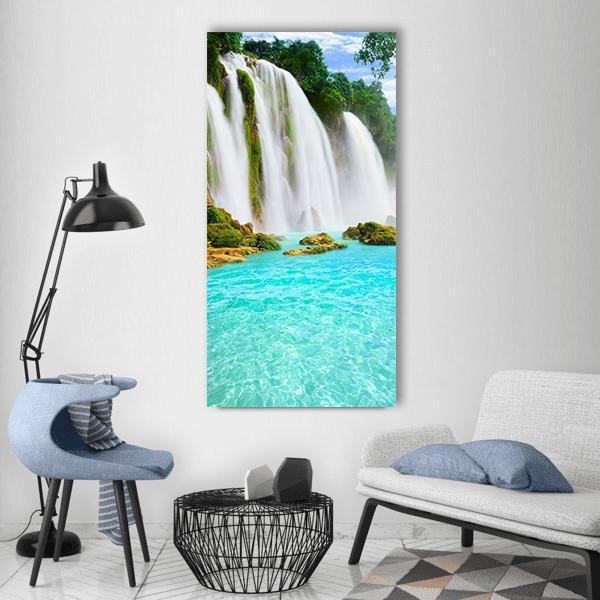 Ban Gioc Waterfall with Turquoise Pool Vertical Canvas Wall Art in white, green and blue, single vertical panel hung on a wall