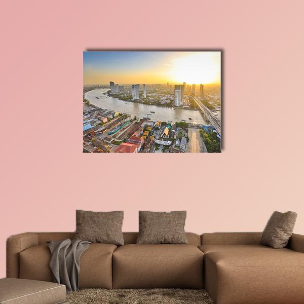 Bangkok River Skyline at Twilight Canvas Wall Art in orange, yellow and blue, single panel hung on a wall