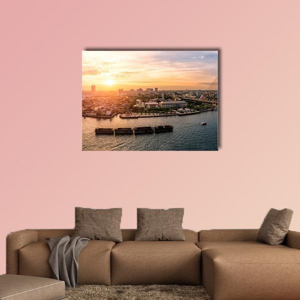 Sunset at Chao Phraya River, Bangkok Canvas Wall Art in orange, yellow and blue, single panel hung on a wall