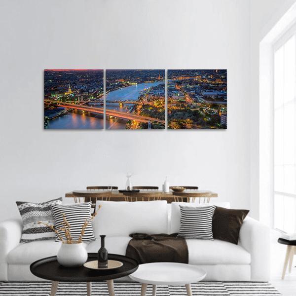 Bangkok River and Bridges at Twilight Panoramic Canvas Wall Art in gold, orange and blue, hung on a wall