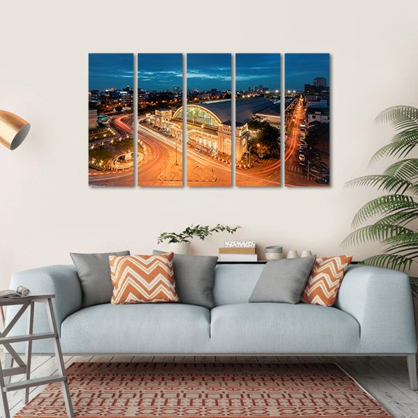 Bangkok Railway Station at Night Canvas Wall Art in orange, yellow and blue, hung on a wall