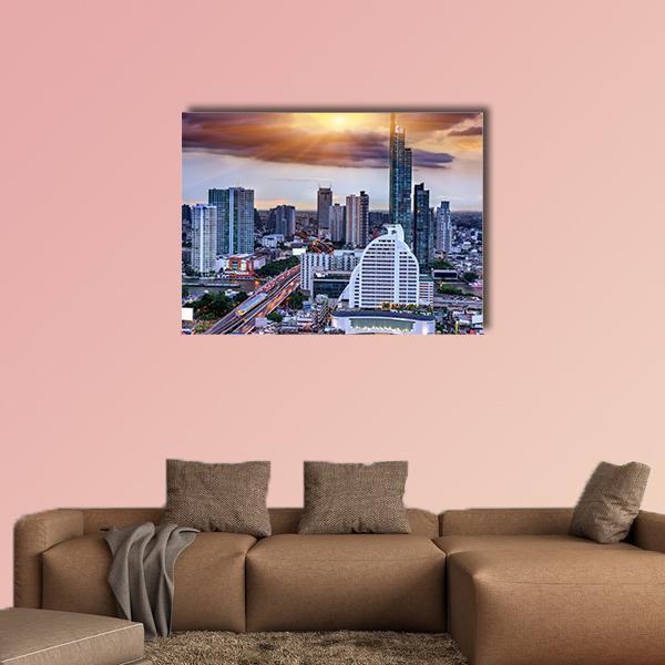 Stormy Sunset Over Bangkok Skyline Canvas Wall Art in gray, orange and blue, single panel hung on a wall