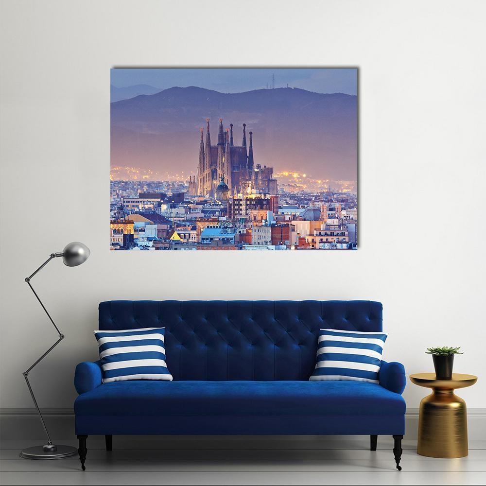 Barcelona at Night Canvas Wall Art in yellow, blue and purple, single panel hung on a wall