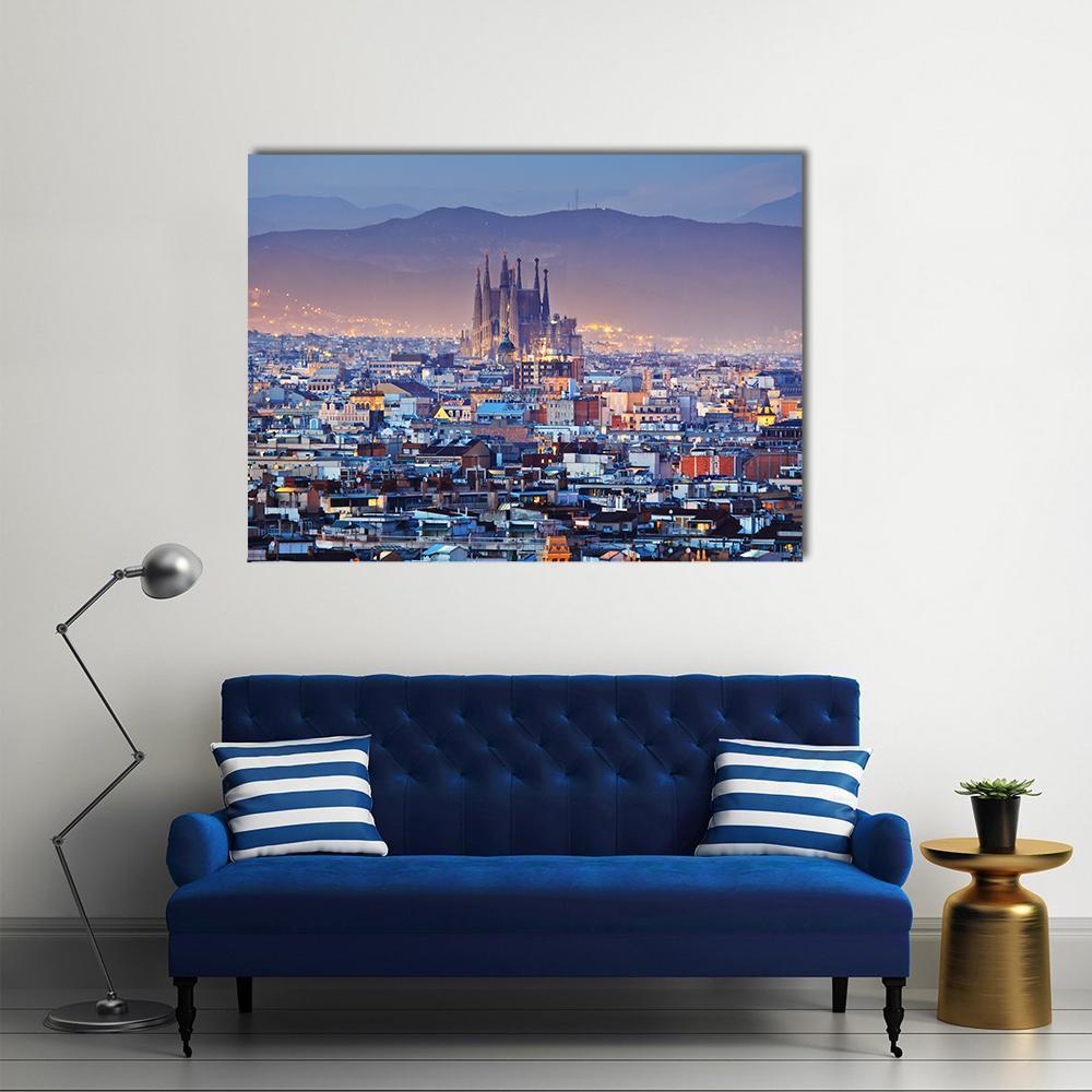 Barcelona Skyline at Dusk Canvas Wall Art in orange, blue and purple, single panel hung on a wall