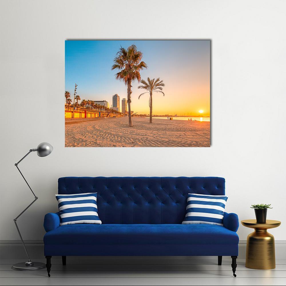 Barceloneta Beach at Sunrise Canvas Wall Art in orange, yellow and blue, single panel hung on a wall