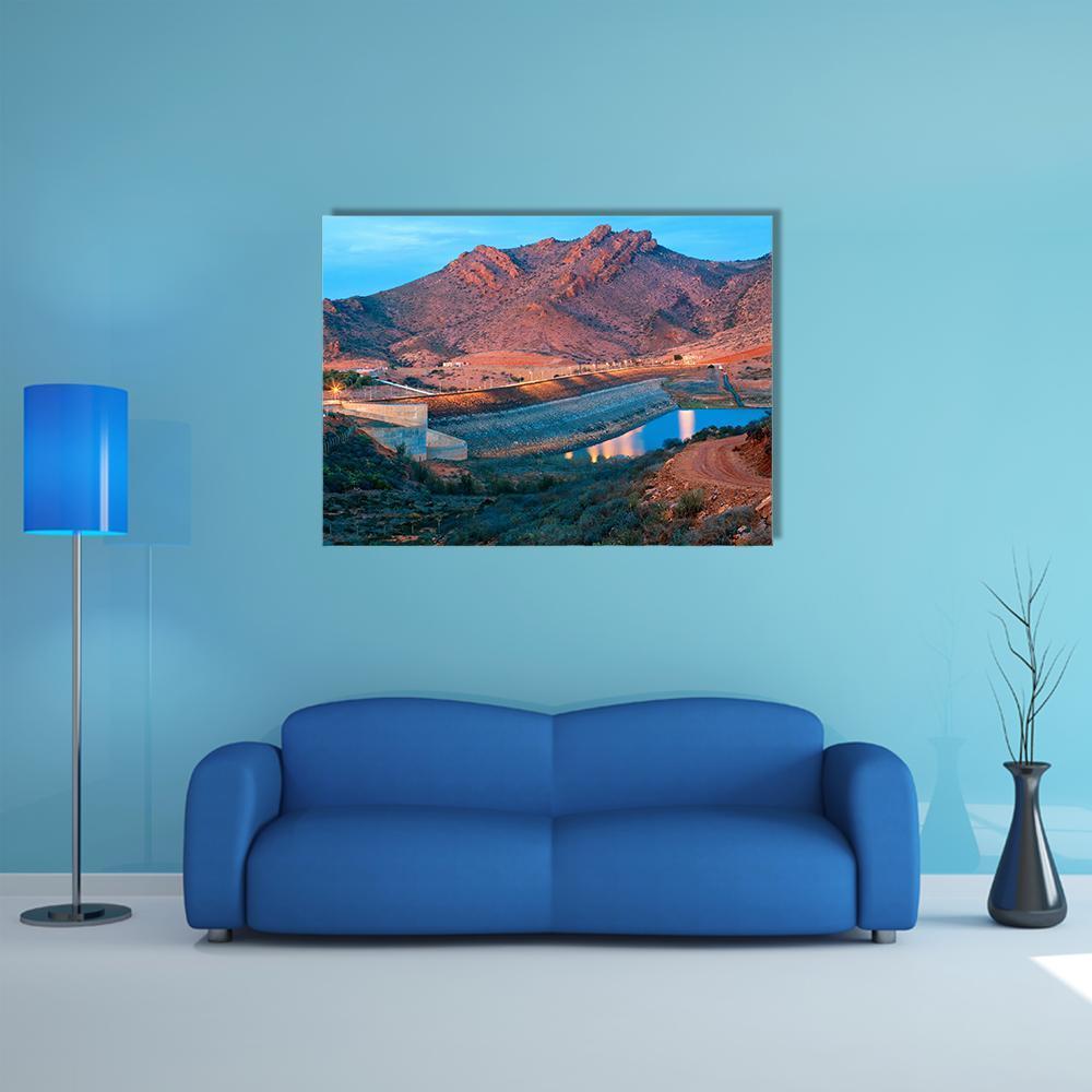 Barrage Youssef Ibn Tachfin Dam at Dusk Canvas Wall Art in brown, orange and blue, single panel hung on a wall
