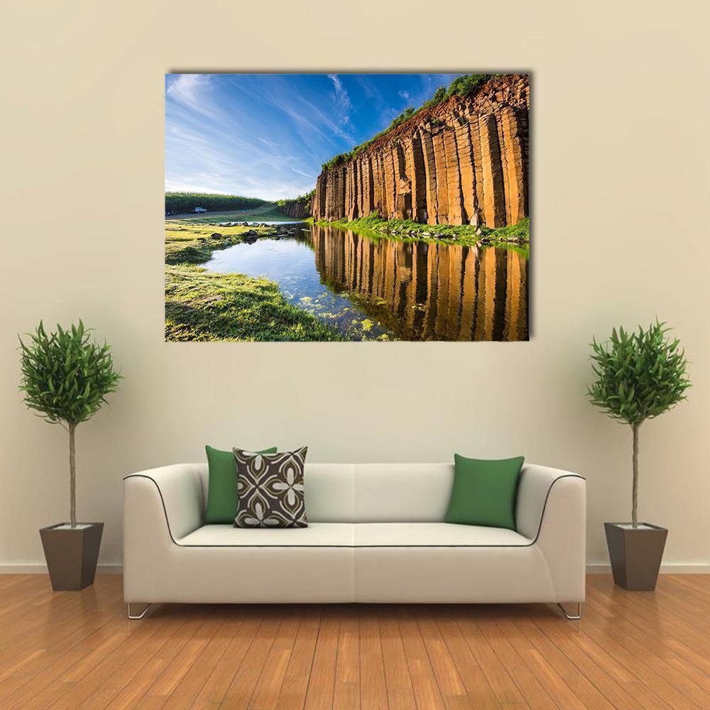 Basalt Columns in Taiwan Canvas Wall Art in brown, green and blue, single panel hung on a wall