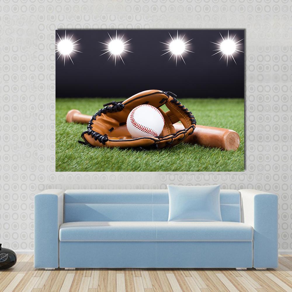 Baseball Glove and Bat Under Stadium Lights Canvas Wall Art in black, brown and green, single panel hung on a wall
