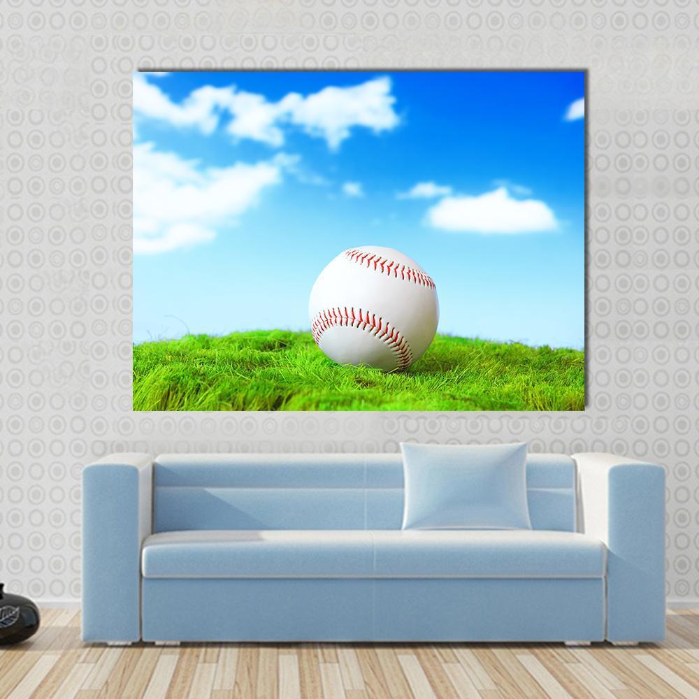 Baseball in Green Grass Canvas Wall Art in white, green and blue, single panel hung on a wall