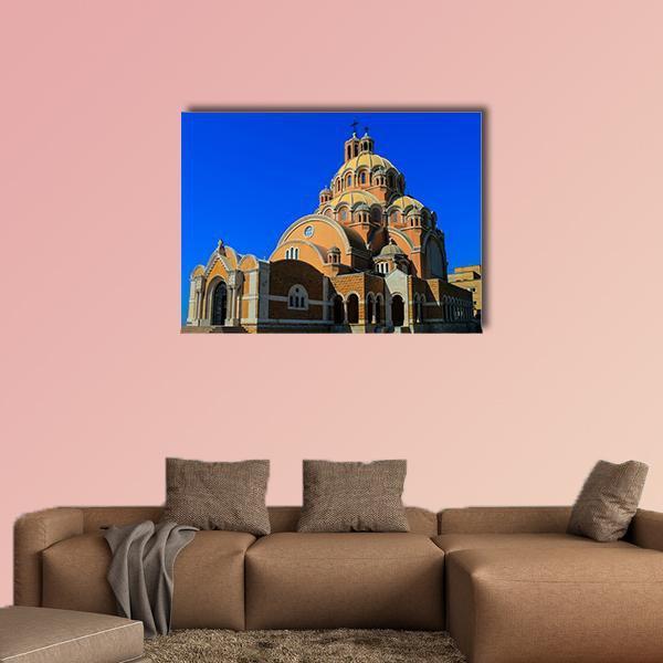 Basilica of Saint Paul Canvas Wall Art in orange, yellow and blue, single panel hung on a wall