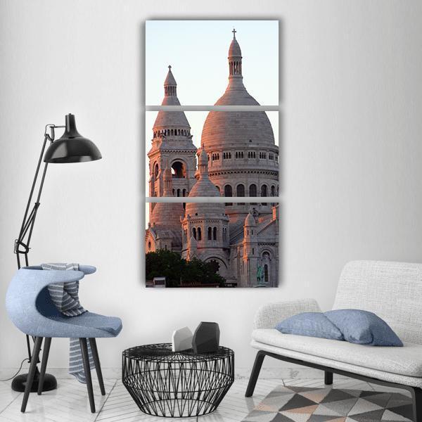 Sacré-cœur Basilica in Paris Vertical Canvas Wall Art in white, gray and beige, single vertical panel hung on a wall