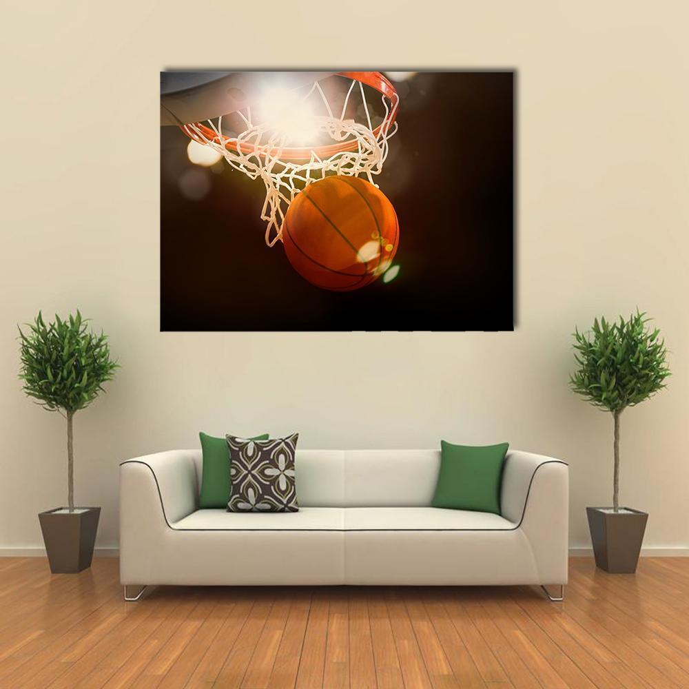 Low-angle Basketball Through Hoop Canvas Wall Art in black, white and orange, single panel hung on a wall