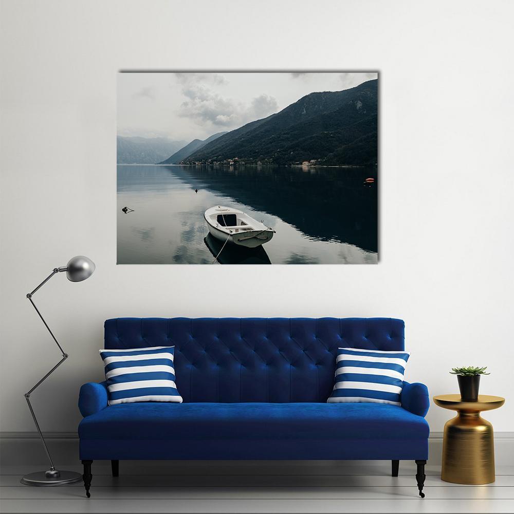 Boat on Bay of Kotor Canvas Wall Art in black, gray and blue, single panel hung on a wall
