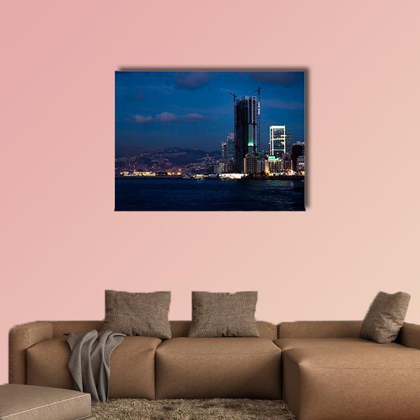 Night Bay Skyline with Skyscraper Canvas Wall Art in black, blue and navy, single panel hung on a wall