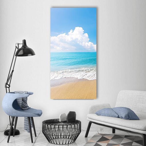 Tropical Sea and Sandy Beach Vertical Canvas Wall Art in white, beige and blue, single vertical panel hung on a wall
