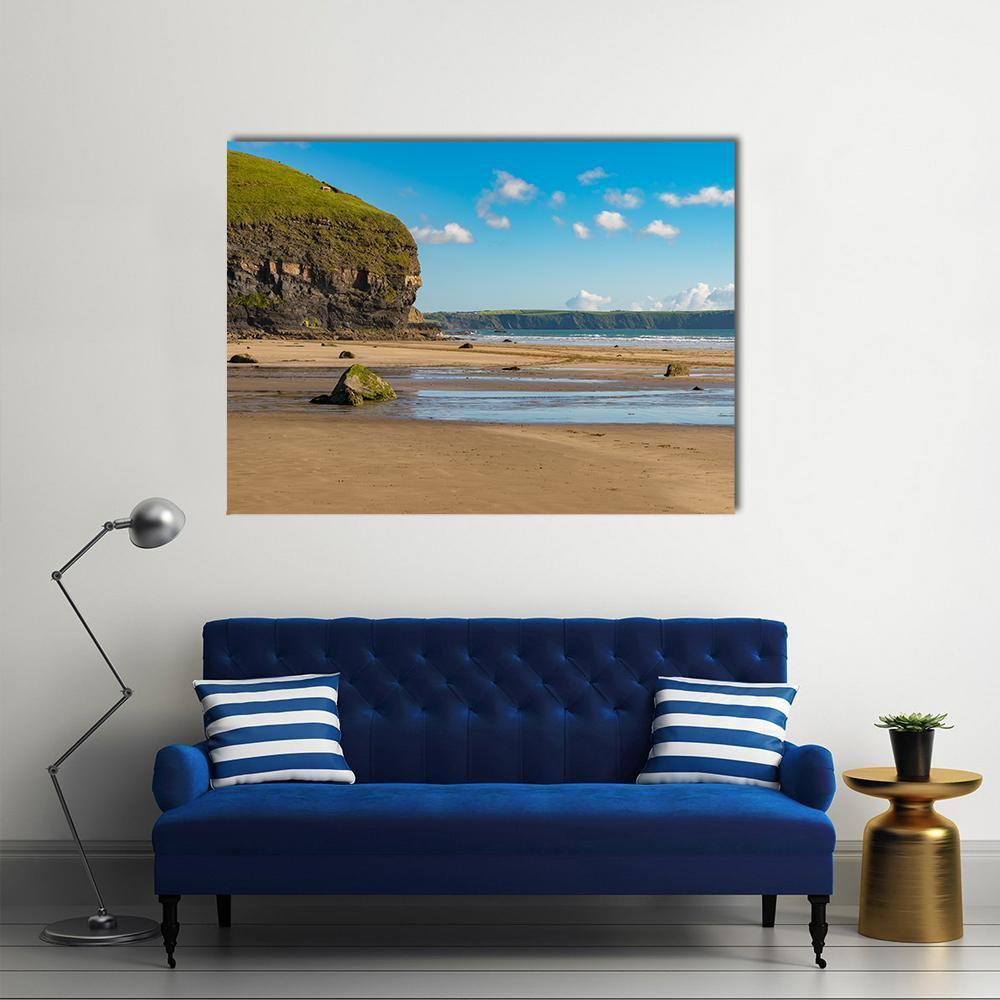 Beach at Druidston Haven Canvas Wall Art in beige, brown and blue, single panel hung on a wall