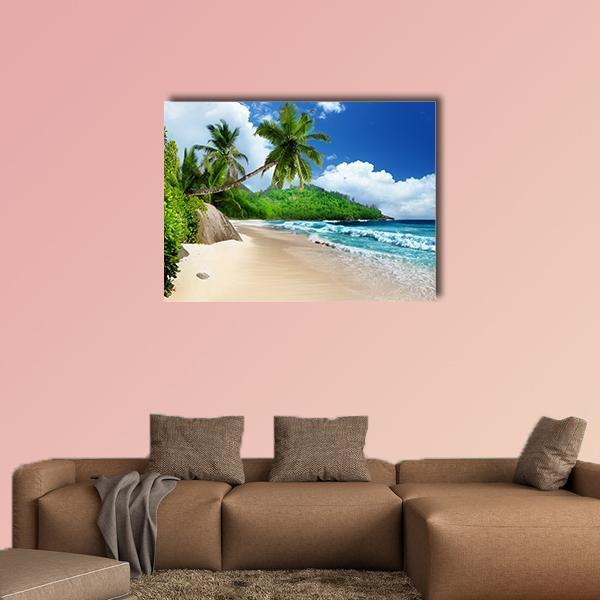 Beach at Mahe Island Canvas Wall Art in beige, green and blue, single panel hung on a wall