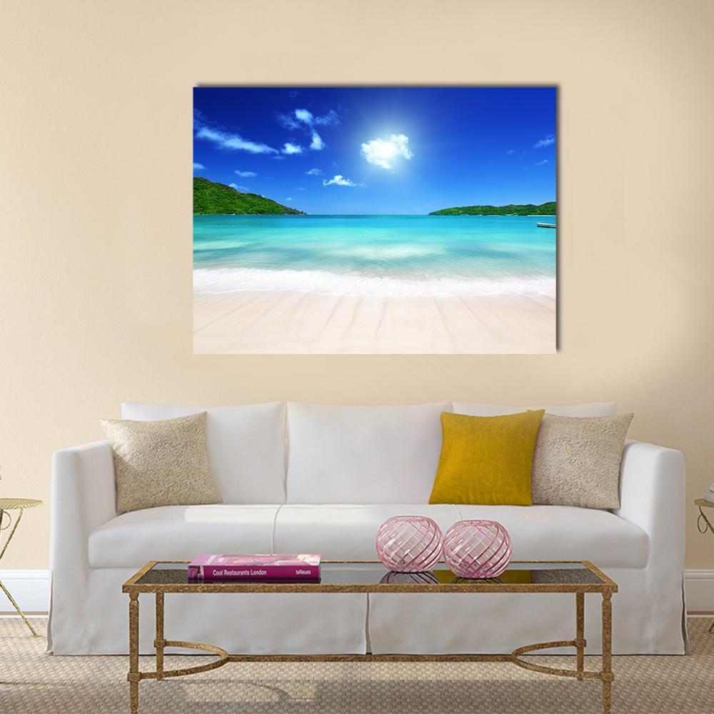 Tropical Beach at Praslin Island Canvas Wall Art in white, beige and blue, single panel hung on a wall