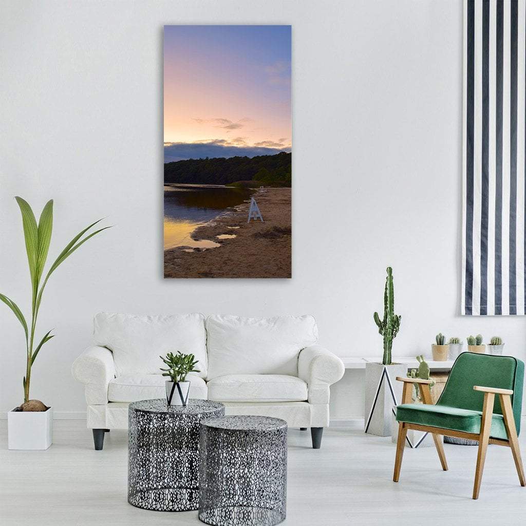White Lifeguard Stand at Sunset Beach Vertical Canvas Wall Art in brown, orange and blue, single vertical panel hung on a wall
