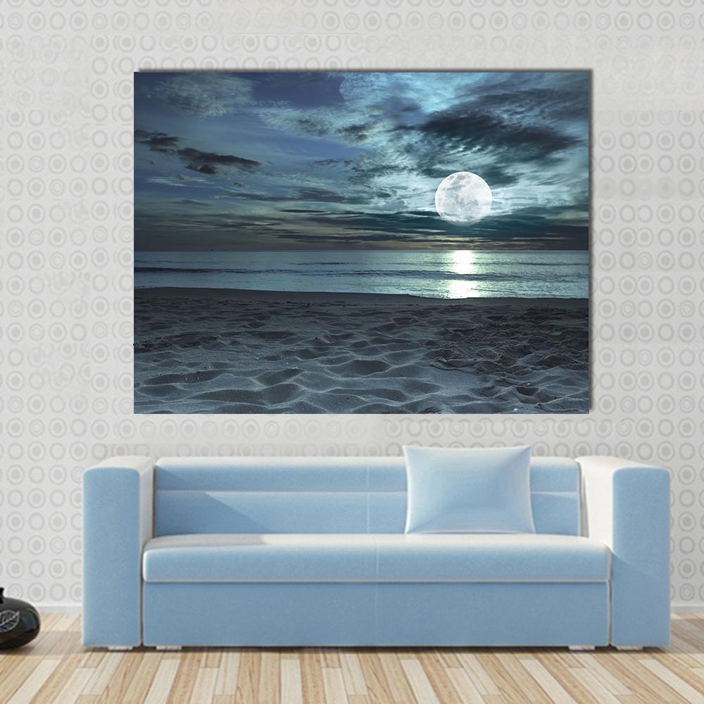 Beach at Twilight Time Canvas Wall Art in gray and blue, single panel hung on a wall