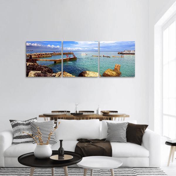 Goree Island Beach View Panoramic Canvas Wall Art in white, brown and blue, hung on a wall