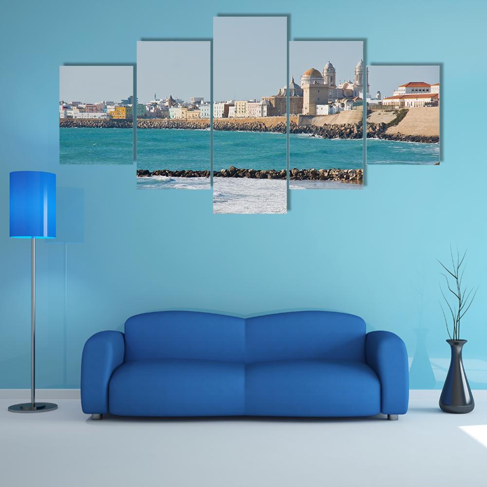 Coastal City Beach with Domed Cathedral Canvas Wall Art in white, beige and blue, 5 panel Star layout hung on a wall