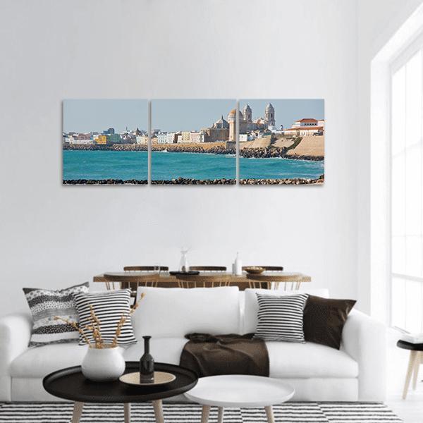 Cádiz Cathedral and Seaside View Panoramic Canvas Wall Art in gray, beige and blue, hung on a wall