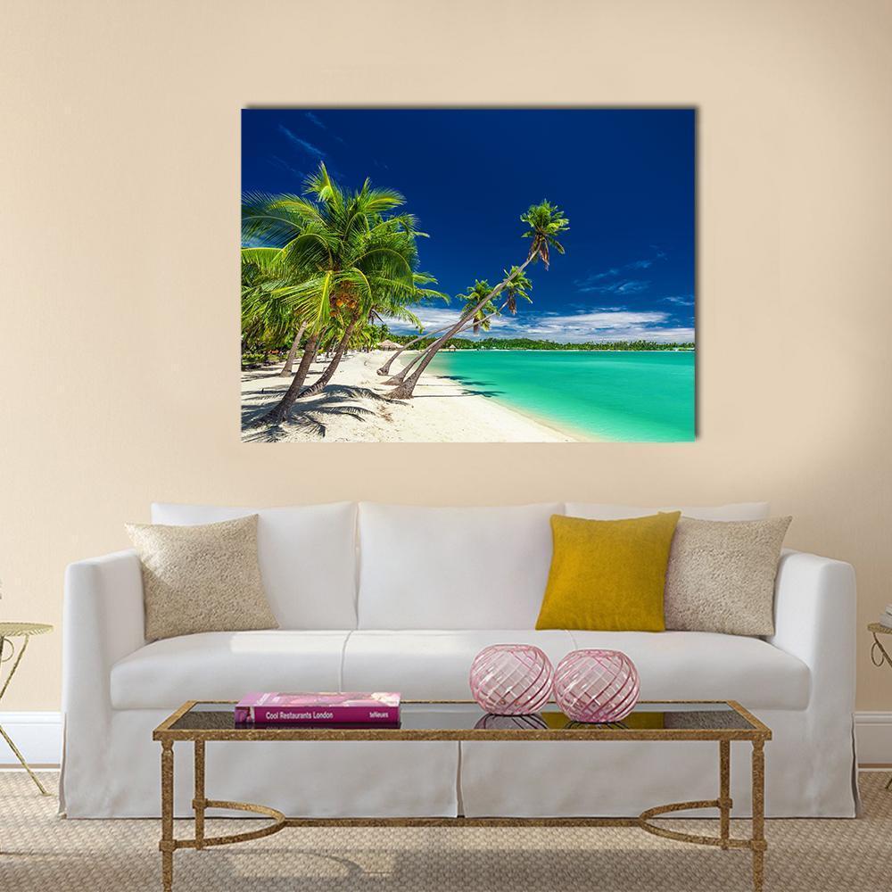 Tropical Beach with Palm Trees Canvas Wall Art in white, green and blue, single panel hung on a wall