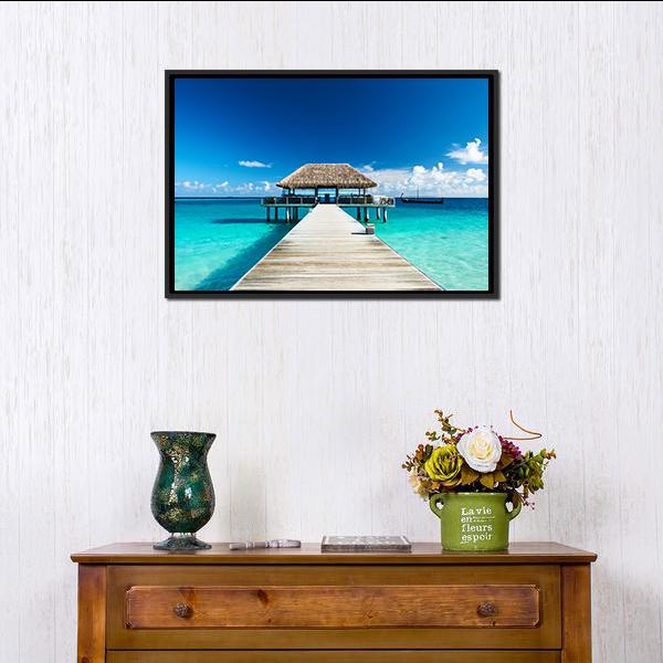Maldives Pier and Thatched Hut on Turquoise Shore Canvas Wall Art in white, beige and blue, framed canvas, product view on a white background