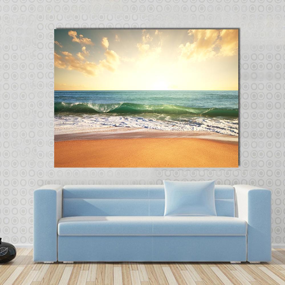 Beach with Smooth Ocean Canvas Wall Art in beige, yellow and blue, single panel hung on a wall