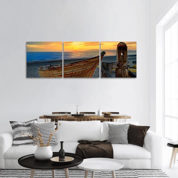 Weathered Boat at Sunset Panoramic Canvas Wall Art in brown, orange and blue, hung on a wall