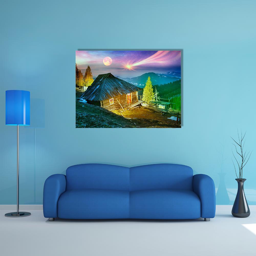 Mountain Cabin Beneath Aurora Borealis Canvas Wall Art in brown, blue and purple, single panel hung on a wall