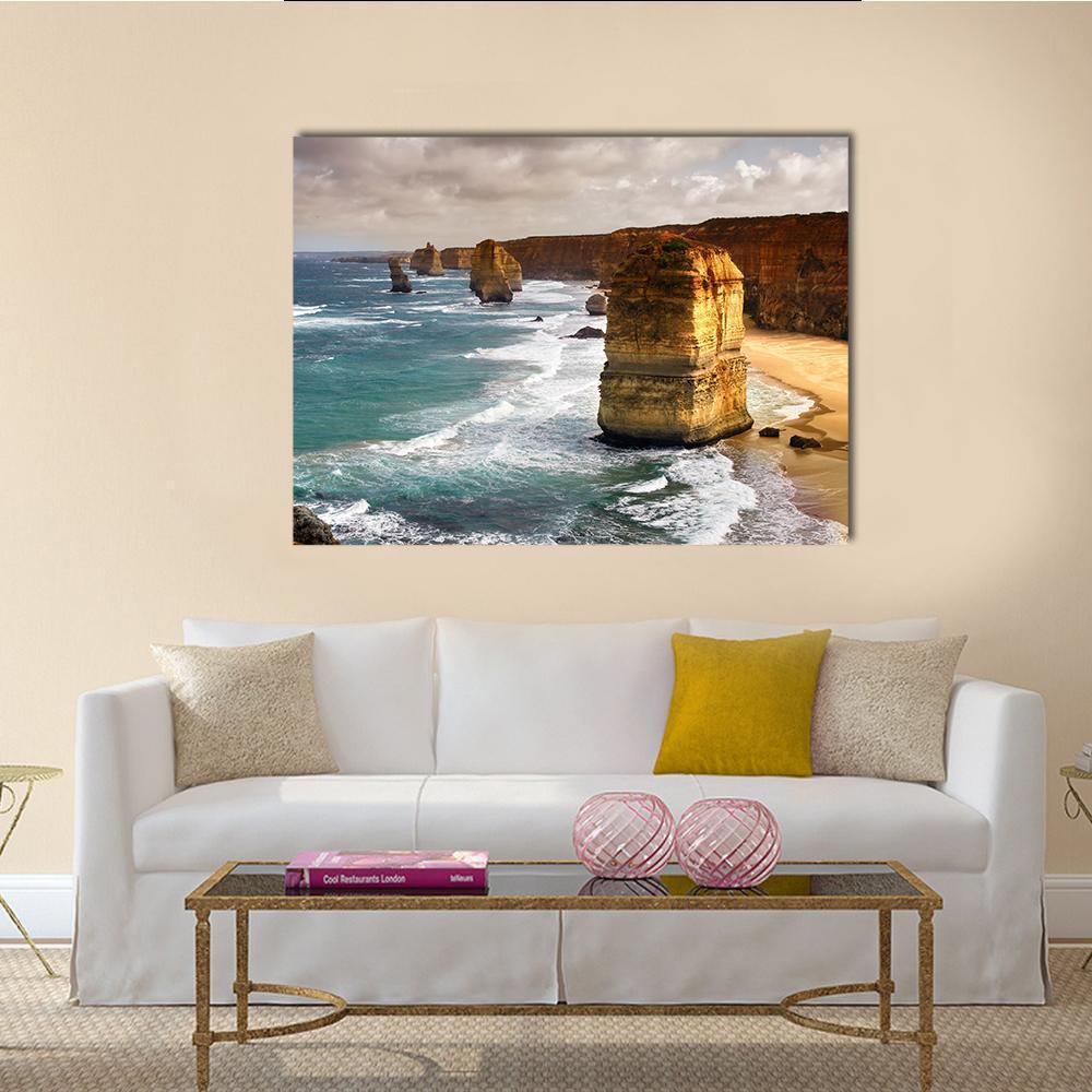 12 Apostles Ocean Cliffs at Golden Hour Canvas Wall Art in gold, orange and blue, single panel hung on a wall