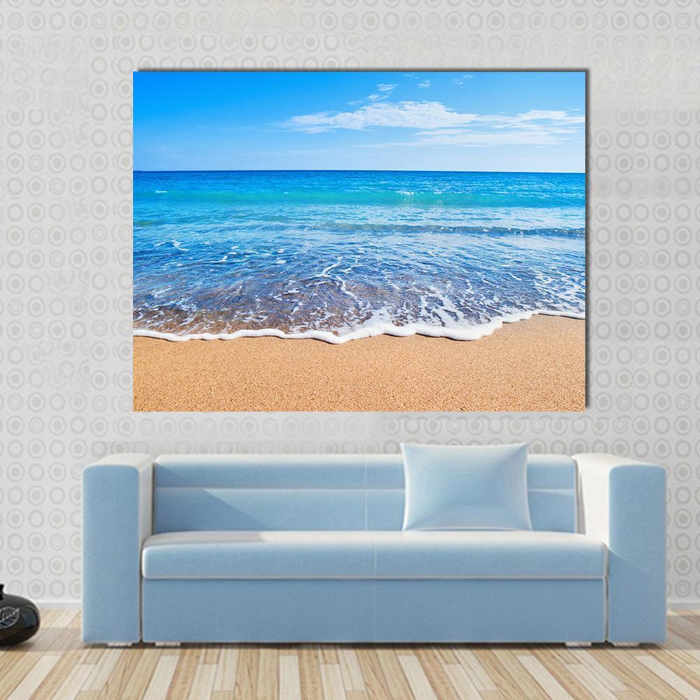 Beautiful Beach and Sea Canvas Wall Art in white, beige and blue, single panel hung on a wall