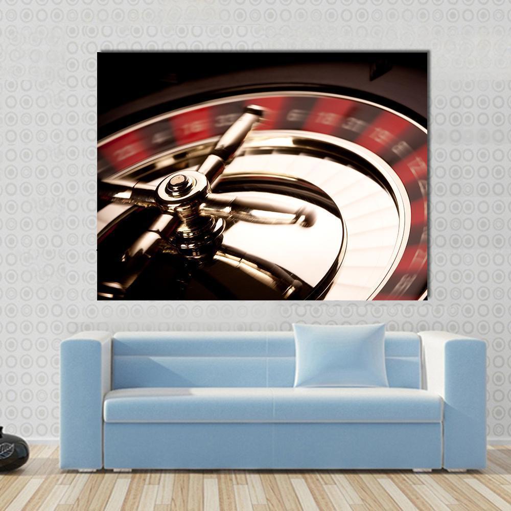 Spinning Roulette Wheel Close-up Canvas Wall Art in black, gold and red, single panel hung on a wall